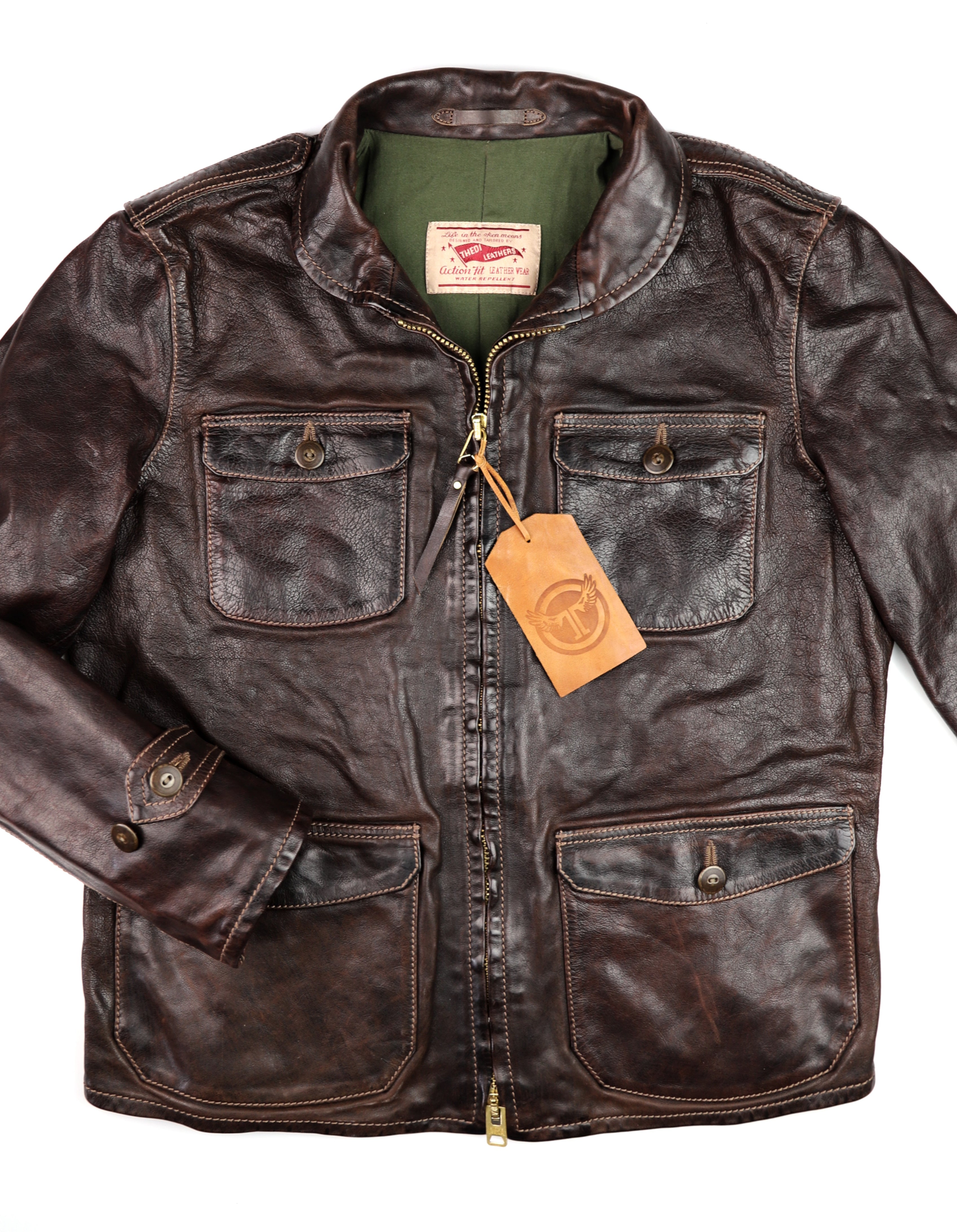 A brown Thedi Atlas Deluxe Half Belt leather jacket with four patch pockets, button cinch cuffs, and a double-ended front zipper.