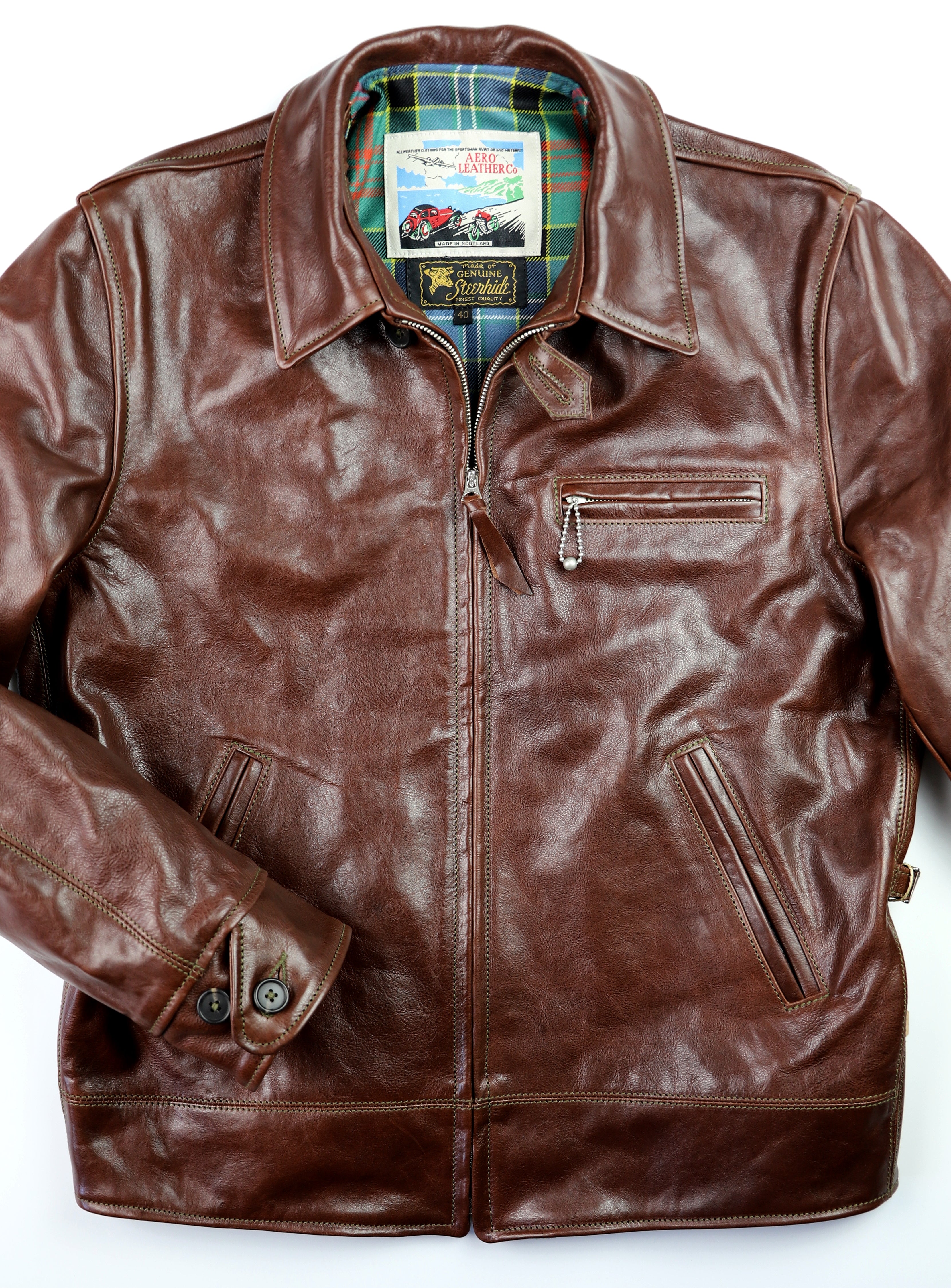 Leather jacket with straight front zipper, three front pockets, button cuffs and shirt collar.
