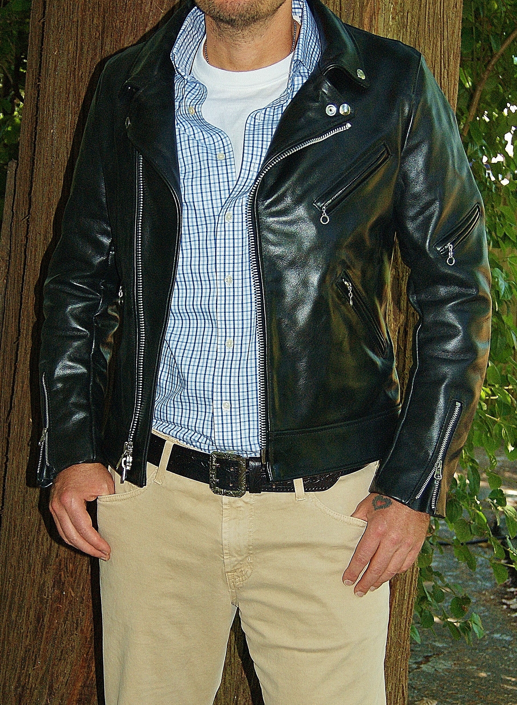Photo of man modelling Vanson Daredevil., black leather motorcycle jacket. Jacket is unzipped.