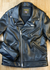 Black leather motorcycle jacket with asymmetrical front opening and collar with lapels.  Three-pocket front and zippered sleeves.  