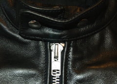 Close-up of nickel main zipper pull.