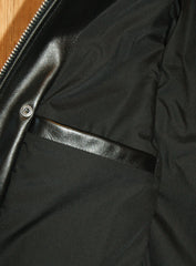 Close-up of right side interior pocket, horizontal opening with no closure.