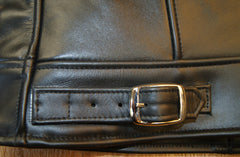 Close-up of nickel buckle-style cinch on lower back.